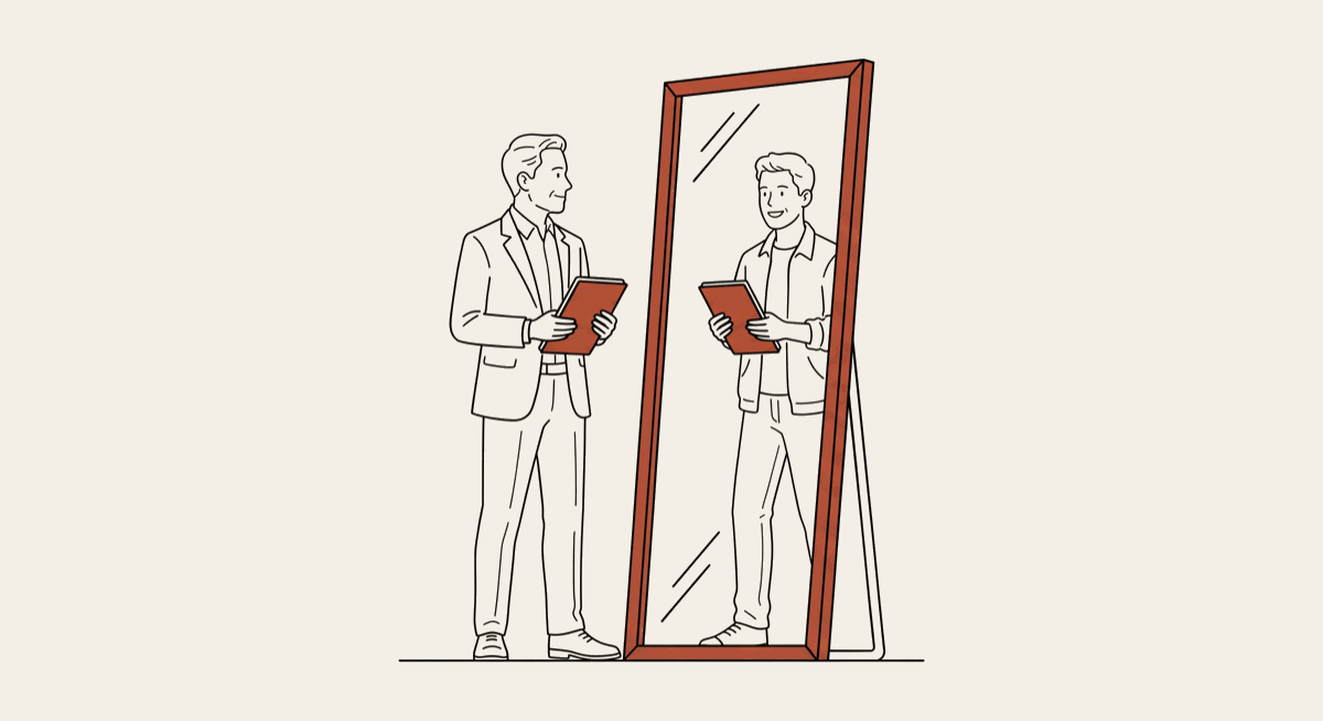 An older business owner in a suit holds a resume and sees a younger, casually dressed version of himself reflected in a full-length mirror &mdash; the interview as a two-way mirror.